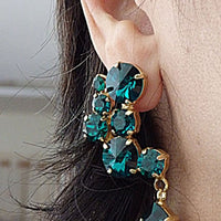 Emerald Stud And Drop Cluster Earrings. Green Teardrop Earrings. Statement Earrings. Rebeka Rhinestone Earrings. Chandelier Earrings.