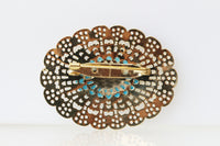 TURQUOISE GOLD BROOCH